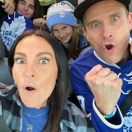 Gabriel Hogan with his family cheering up for their favorite team
